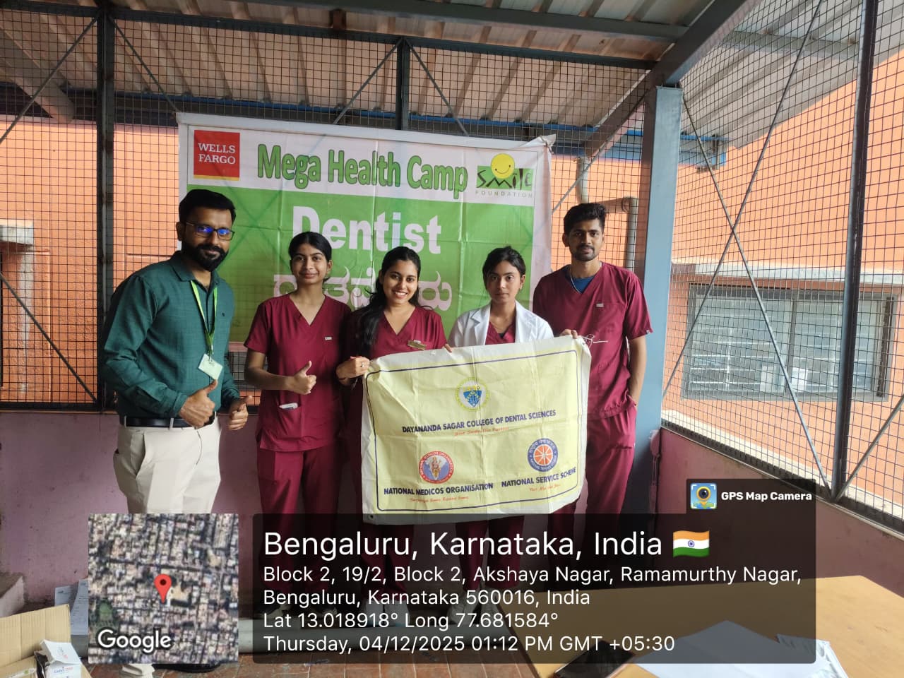 Dental team holding a banner for Dayananda Sagar College of Dental Sciences
